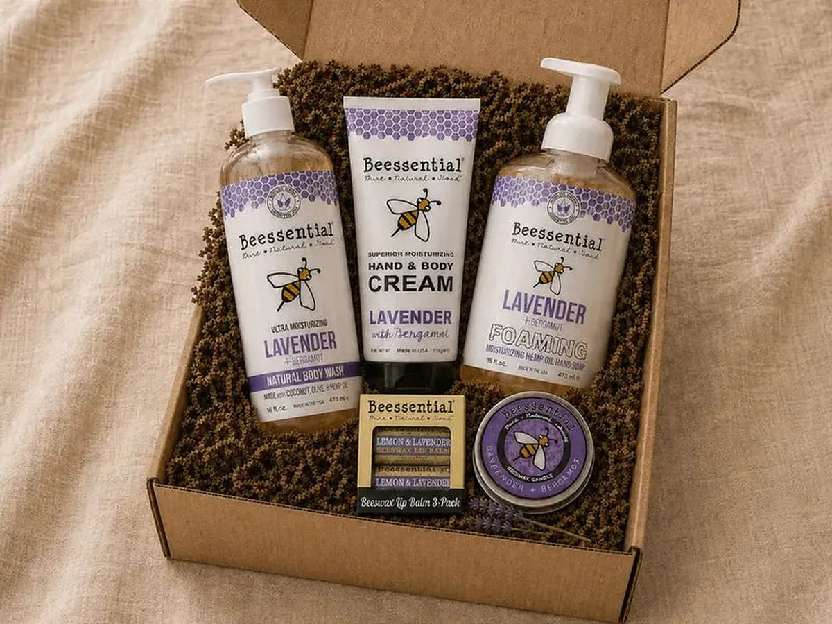 Beessential Lavender Bliss gift set arranged inside a Buzz Box with lavender body wash, foaming hand soap, hand cream, lip balm, and beeswax candle